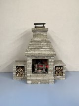 Outdoor Fireplace with burning embers and flame logs
