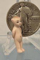 (image for) Unusual Kewpie with hands behind the back