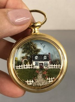 Watch Case with miniature house and fence