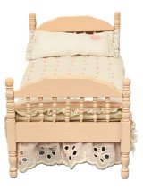 Pink wooden bed with handmade quilt and pillow (image for) Pink wooden bed with handmade quilt and pillow