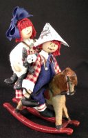 (image for) Raggedy Ann and Andy Riding a Rocking Horse by M. Thomas