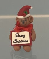 (image for) Brown bear Wearing a Santa Hat Holding 'Beary Christmas' sign