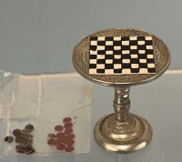 (image for) Checkers on a Metal Table