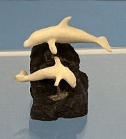 Dolphins jumping out of the water figurine