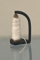 (image for) White Thread on a Stand for a Sewing Machine
