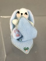 Bunny with Pink Cheeks in a Blanket