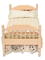 (image for) Pink wooden bed with handmade quilt and pillow