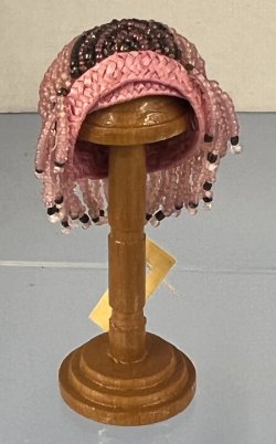 Beaded Hat on Wooden Stand