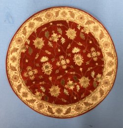 Red and gold round rug