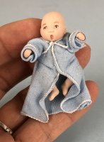 Tiny Baby in Blue Bathrobe