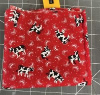 (image for) Small cow on red background fabric