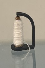 (image for) White Thread on a Stand for a Sewing Machine