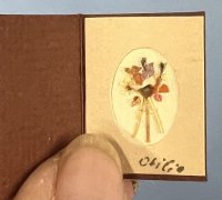 (image for) Dried flowers in a framed holder with cover