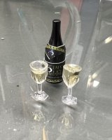 (image for) Tiny Bubbles Champagne and two filled glasses