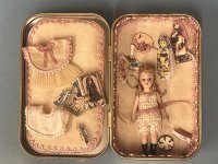 (image for) Little Doll with Belongings in Tin