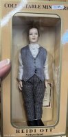 (image for) Red haired man doll dressed in plaid pants, blue vest, white shirt