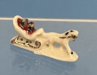 Porcelain sled with carriage