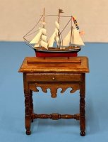 (image for) Table with a ship on display