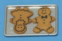Gingerbread Boy & Girl On Cookie Sheet