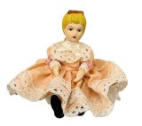 (image for) Blonde girl in peach and white dress